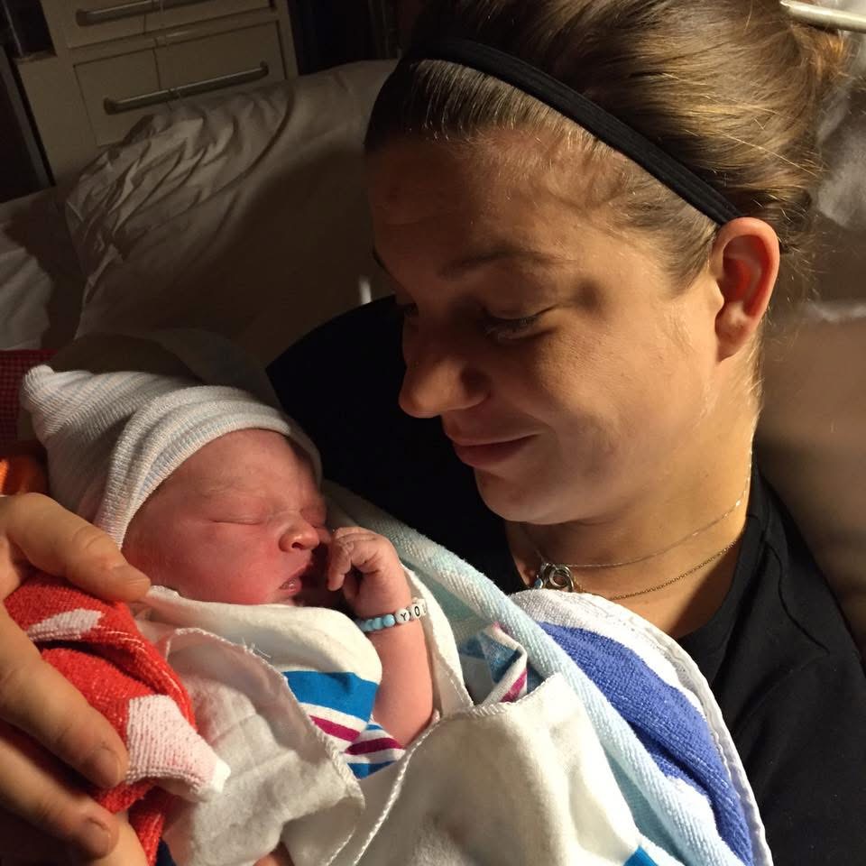 Dr. Verena holding her newborn in the hospital